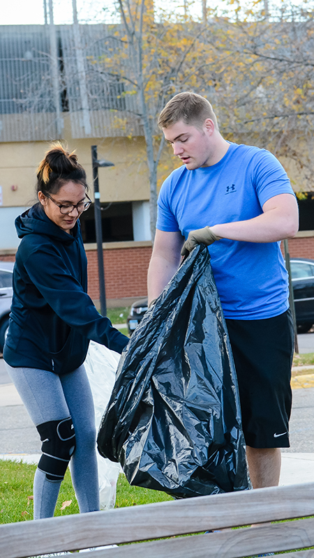 Students picking up garbage on campus