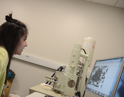 Student works on the Scanning Electron Microscope