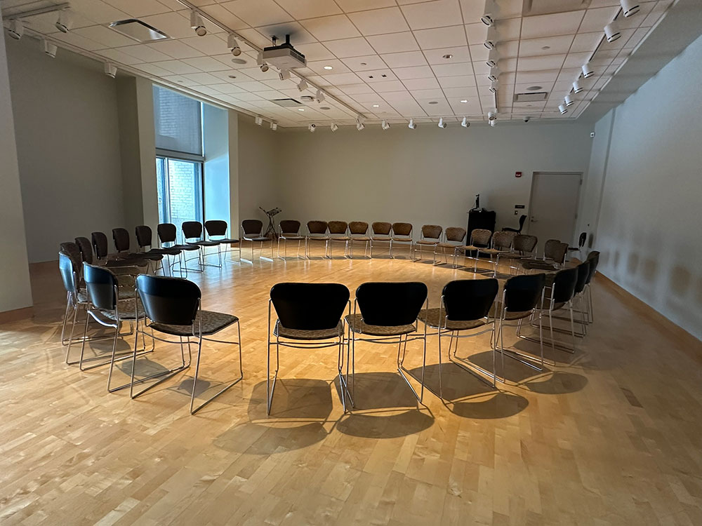 an interior view of the Gallery Room in Atwood Memorial Center showing multiple chairs in a circular setup