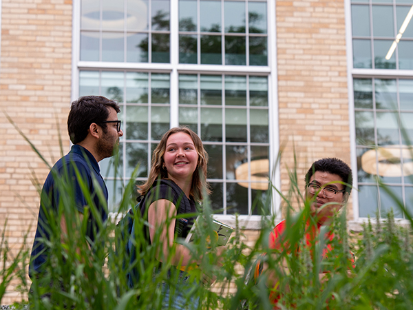 Students walking by Eastman Hall