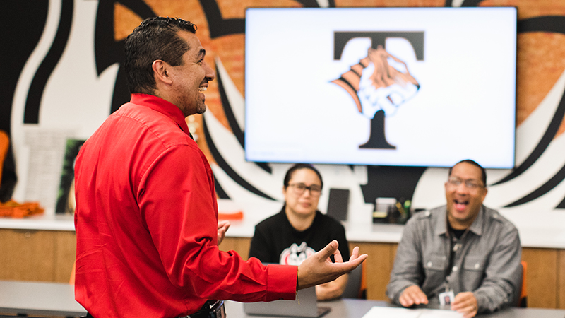 Tech High School employee presenting in meeting room