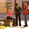 3 students hanging out outdoors on campus