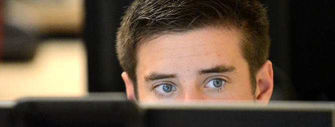 Student works through a fraud analaysis/forensic accounting assessment in a Centennial Hall computer lab