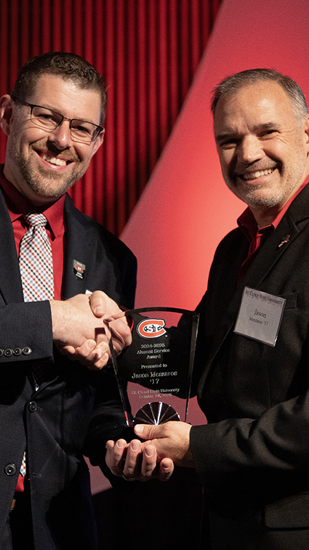 Jason Meszaros receives his alumni award