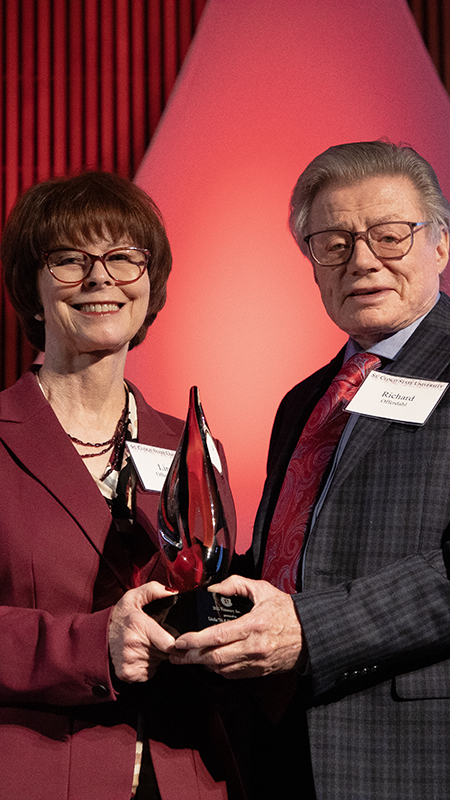 Linda and Richard Offerdahl pose for a photo with their alumni award