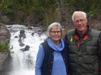 Grant and Carol Nelson pictured in front of a waterfall