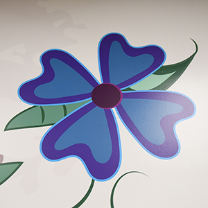 Blue flower painted on a wall mural