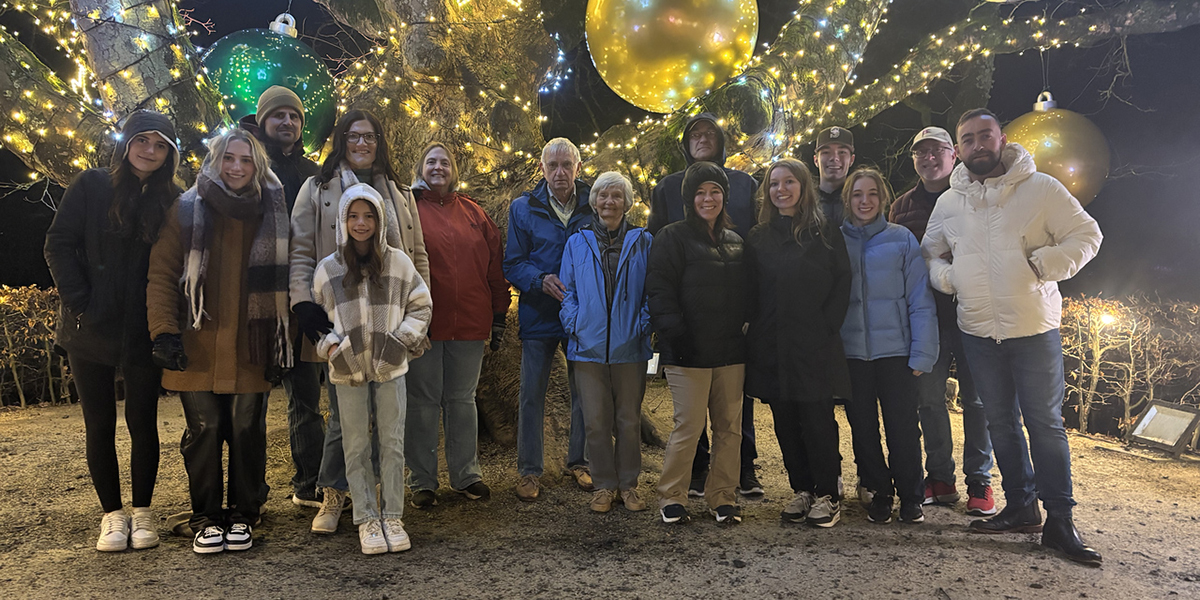 A group of people enjoying holiday lights in the Poison Gardens in Alnwick, England