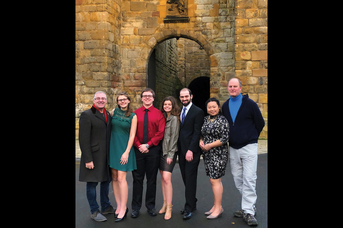 Class photo in front of castle
