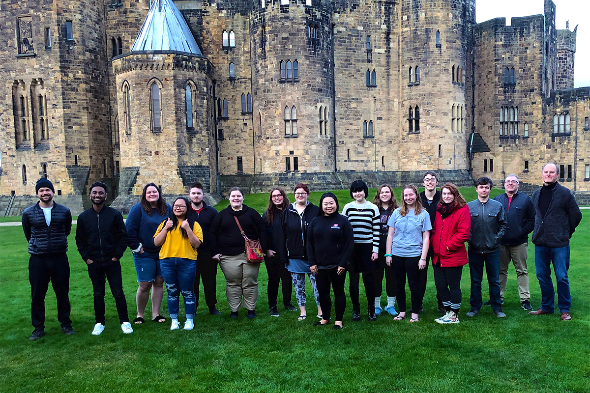 Class photo in front of castle