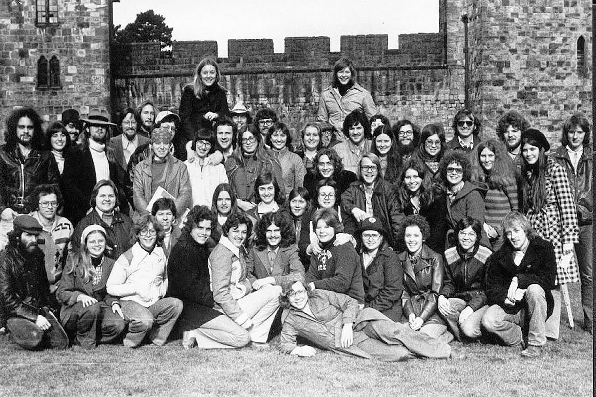 Black and white photo of student in front of castle