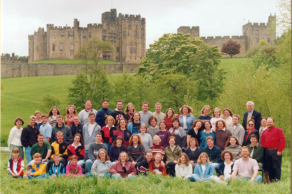 Class photo in front of castle