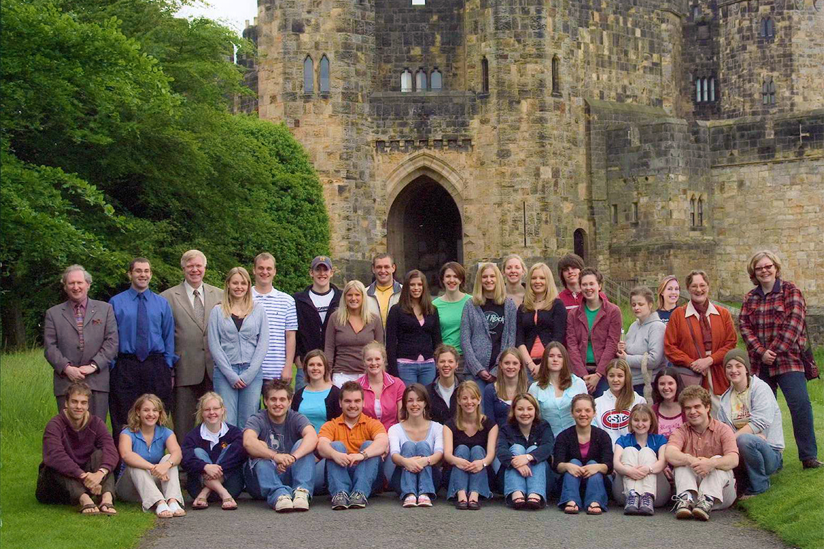 Class photo in front of castle