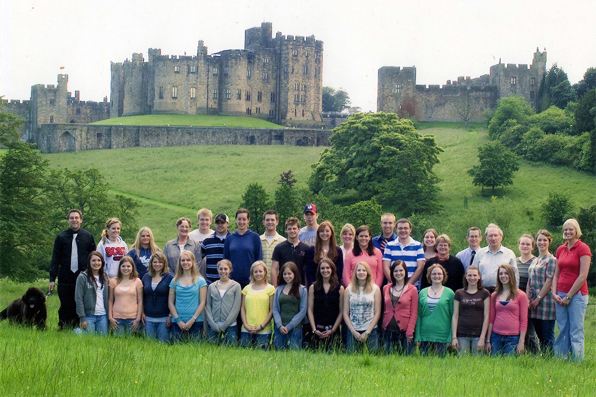 Class photo in front of castle
