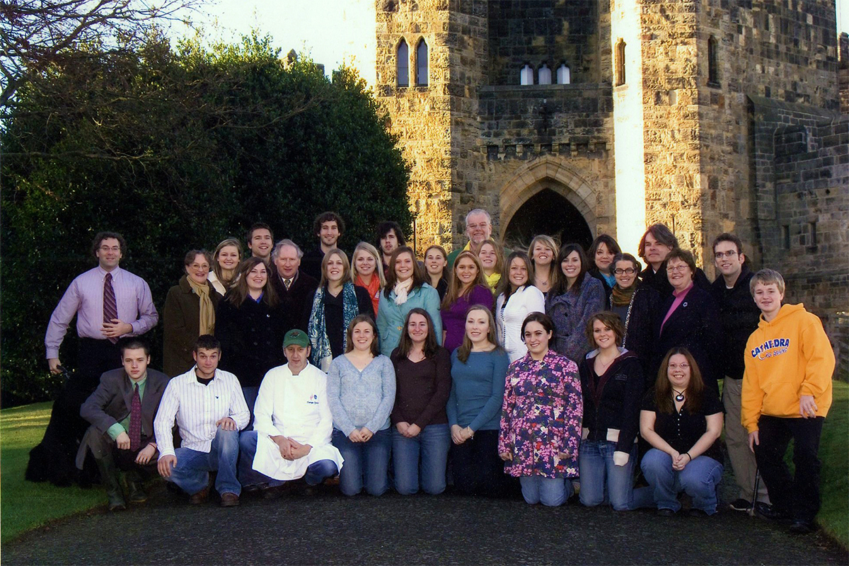 Class photo in front of castle