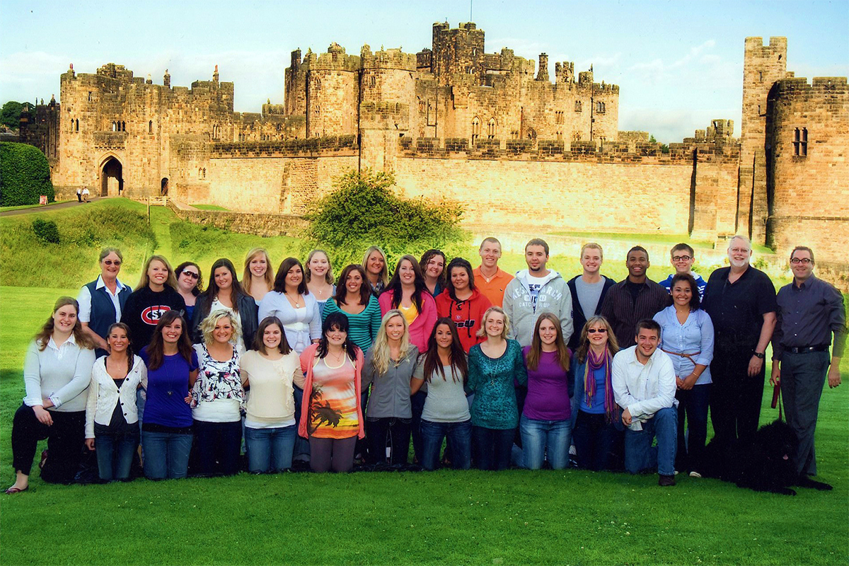 Class photo in front of castle