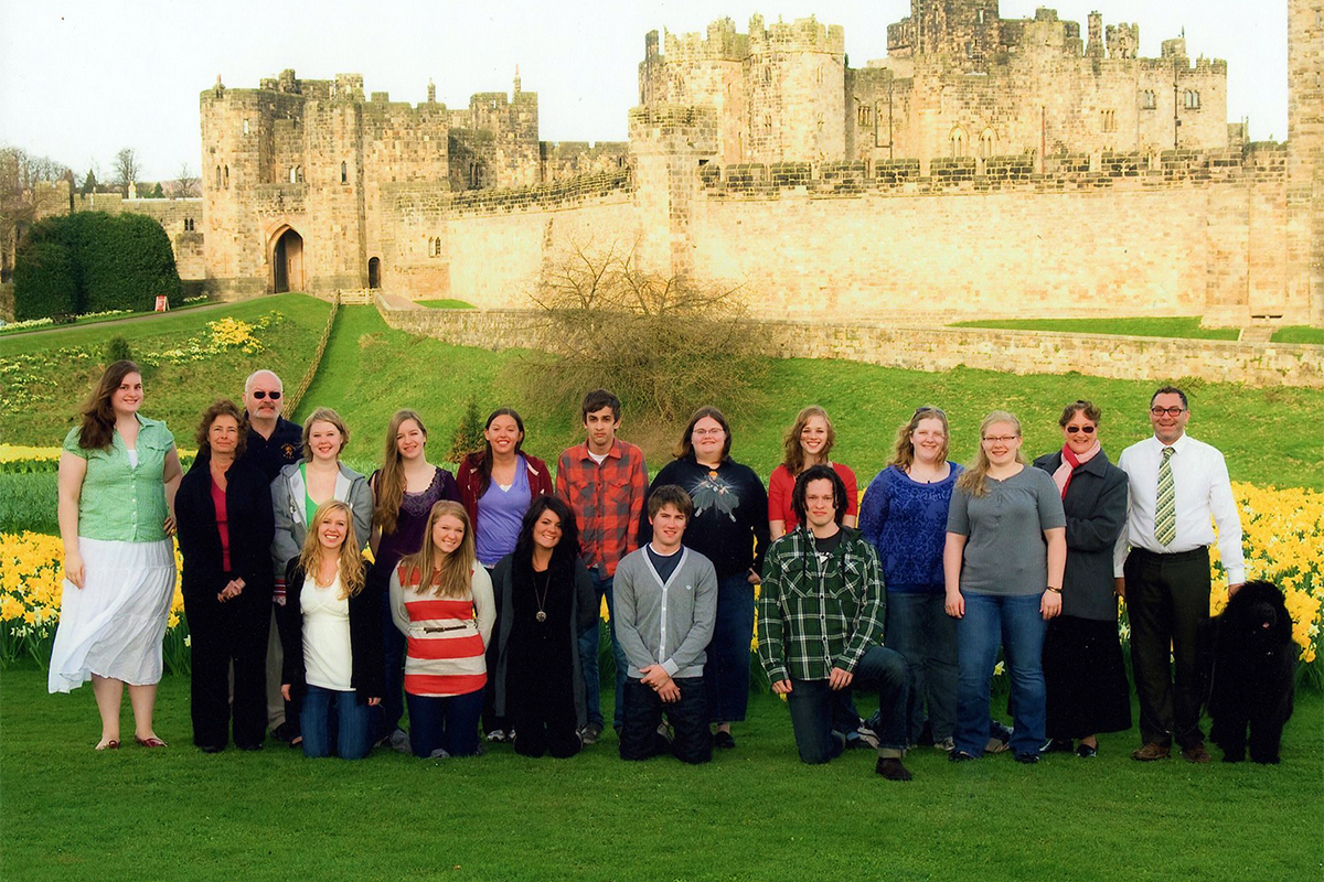 Class photo in front of castle