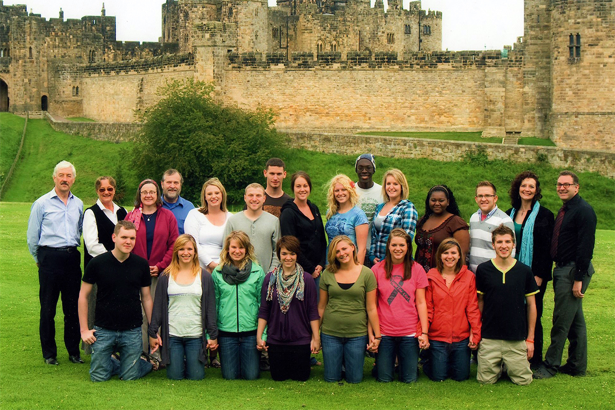 Class photo in front of castle