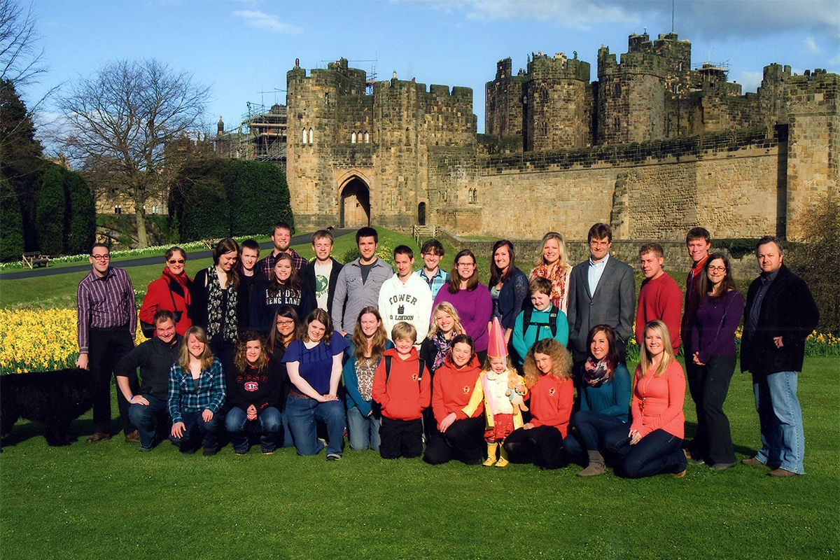 Class photo in front of castle