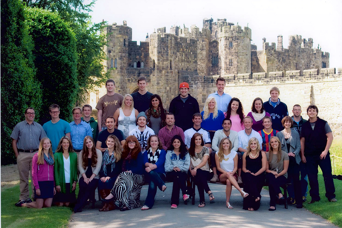 Class photo in front of castle