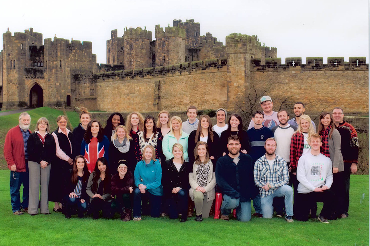 Class photo in front of castle