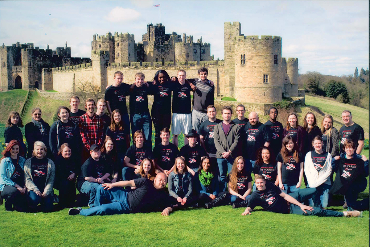 Class photo in front of castle