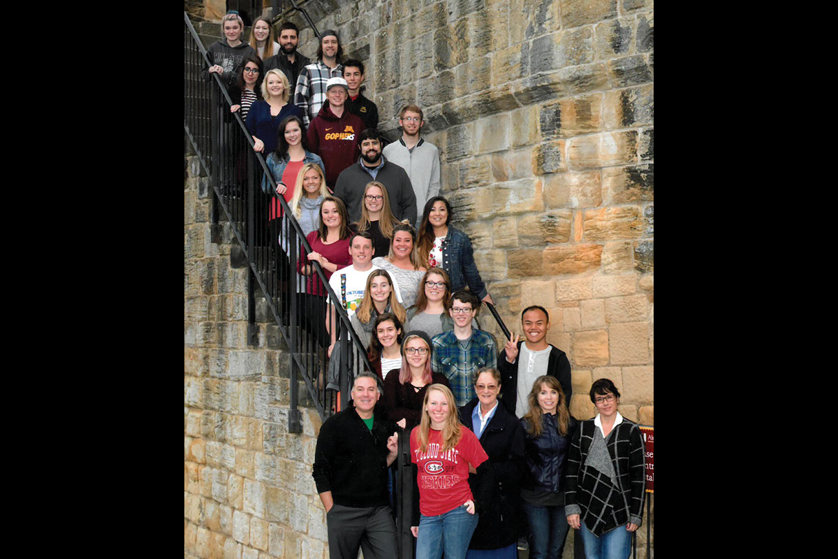 Class photo in front of castle