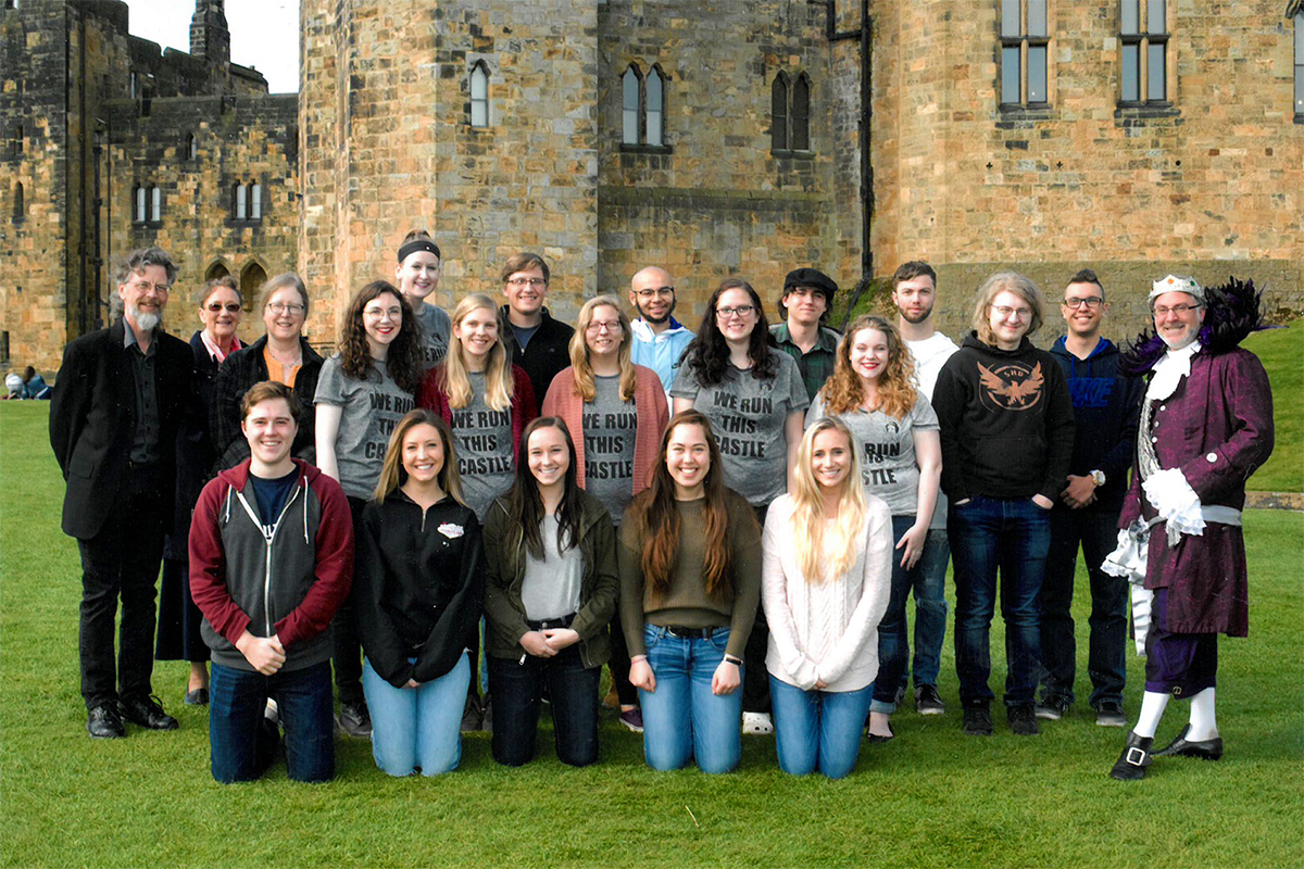 Class photo in front of castle