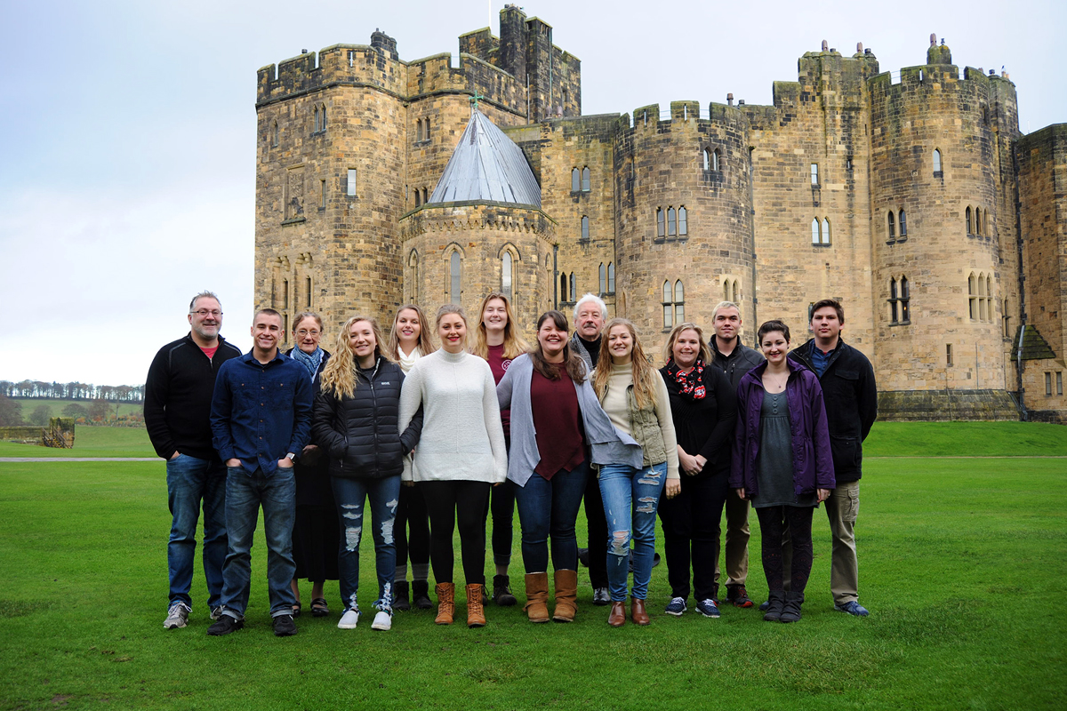 Class photo in front of castle