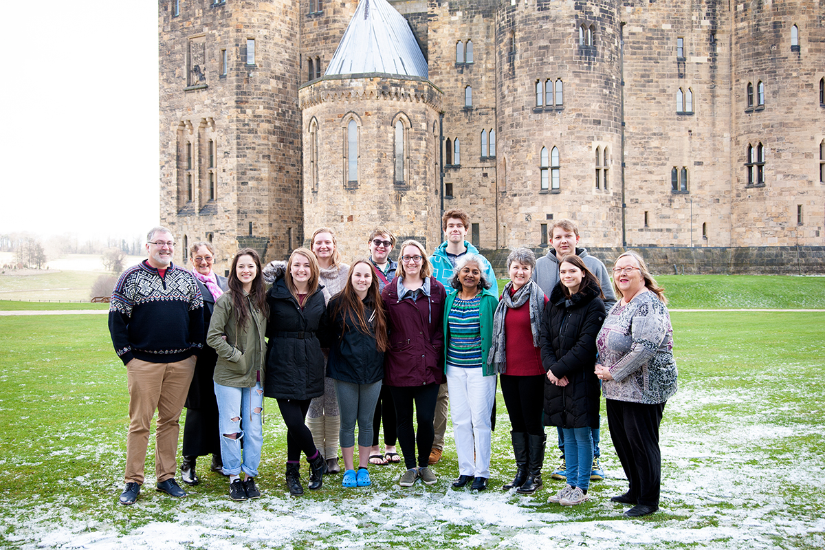 Class photo in front of castle