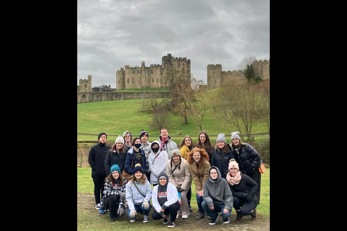 Class photo in front of castle
