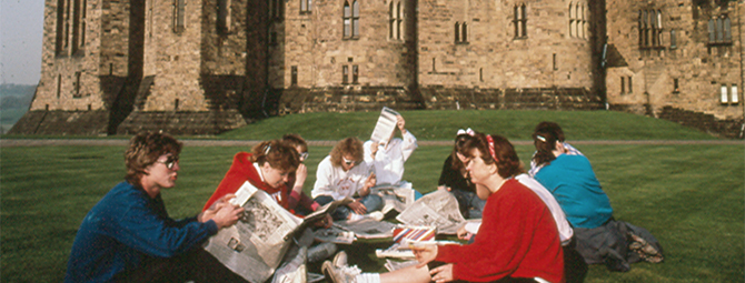 St. Cloud State students reading newspapers in the Main Keep area