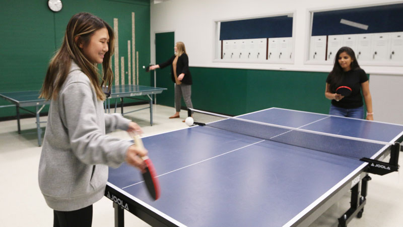 Two people playing table tennis at the Underground located in Atwood Memorial Center