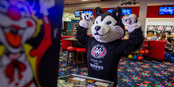 Blizzard mascot playing an arcade game