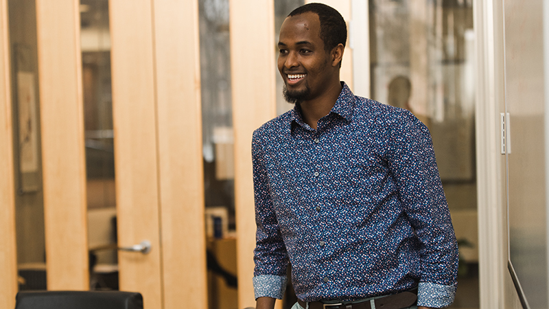 Student in dress shirt presenting