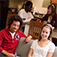 Students hanging out in a living room at Coborn Plaza Apartments 