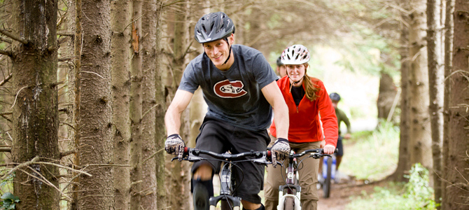 Students ride the Jail Trail east of campus