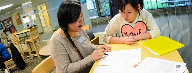 Career Center staff helping a student with their resume