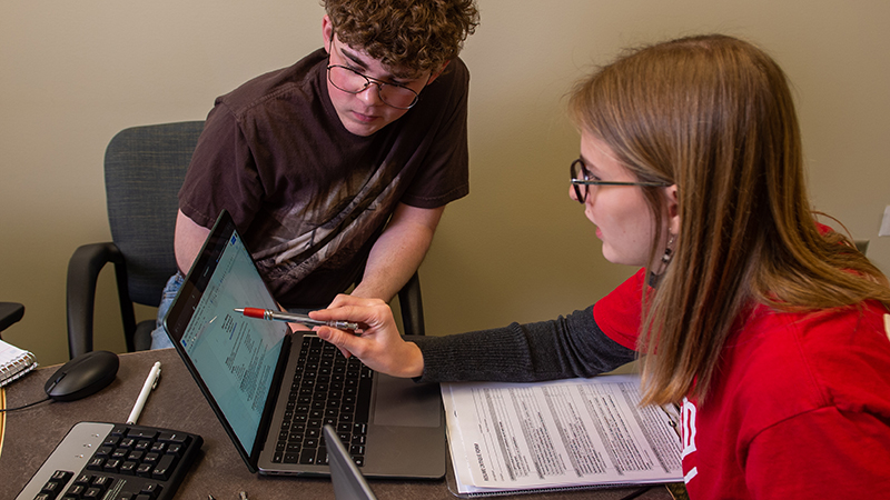 A student receives help with resume