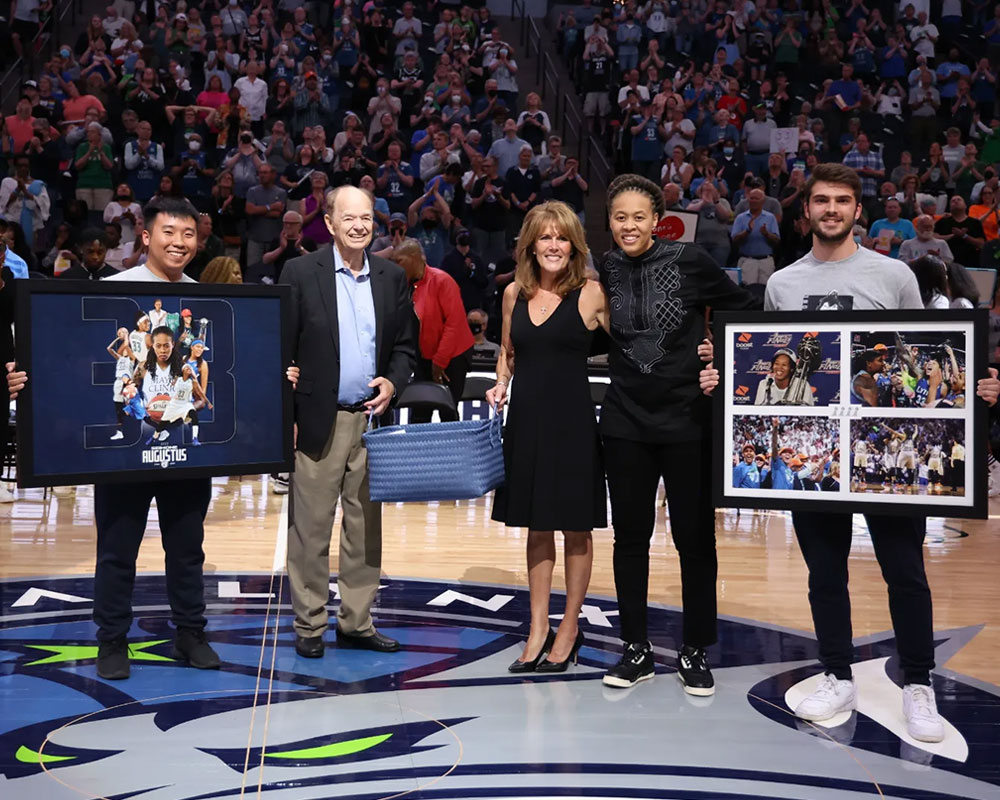 photo of intern Steve Yang with others at a Minnesota Lynx game 