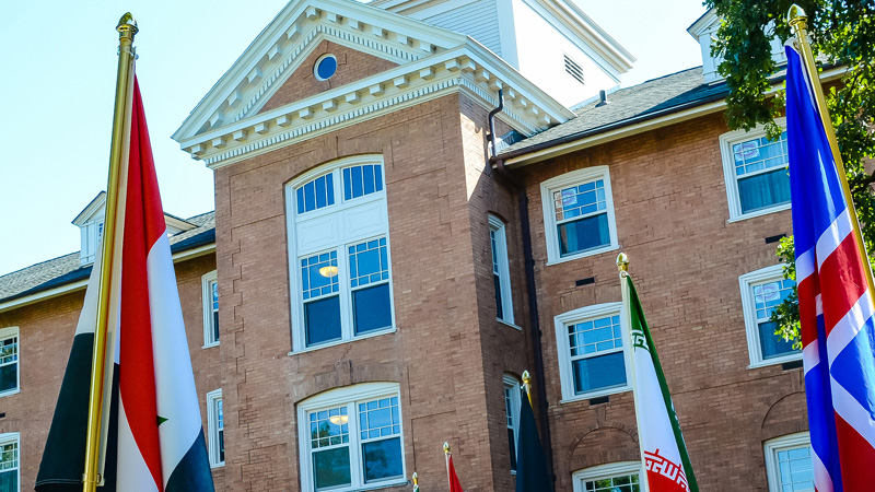 St Cloud State University Centre for International Studies, Lawrence Hall with flags of different countries erected on the walkway