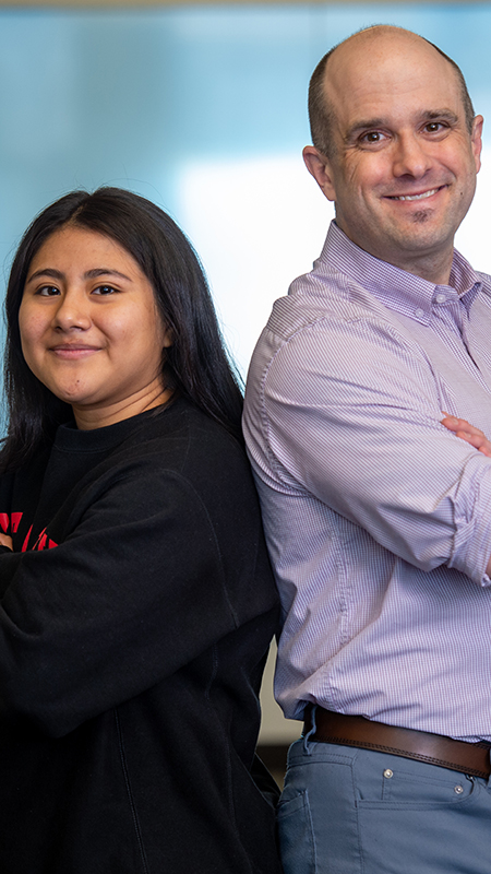 Dr. Vorrell standing back to back with Huskies Advance mentee