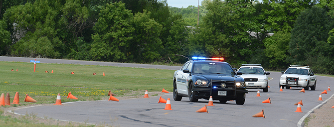 Officers train for a police chase on the MHSRC course.
