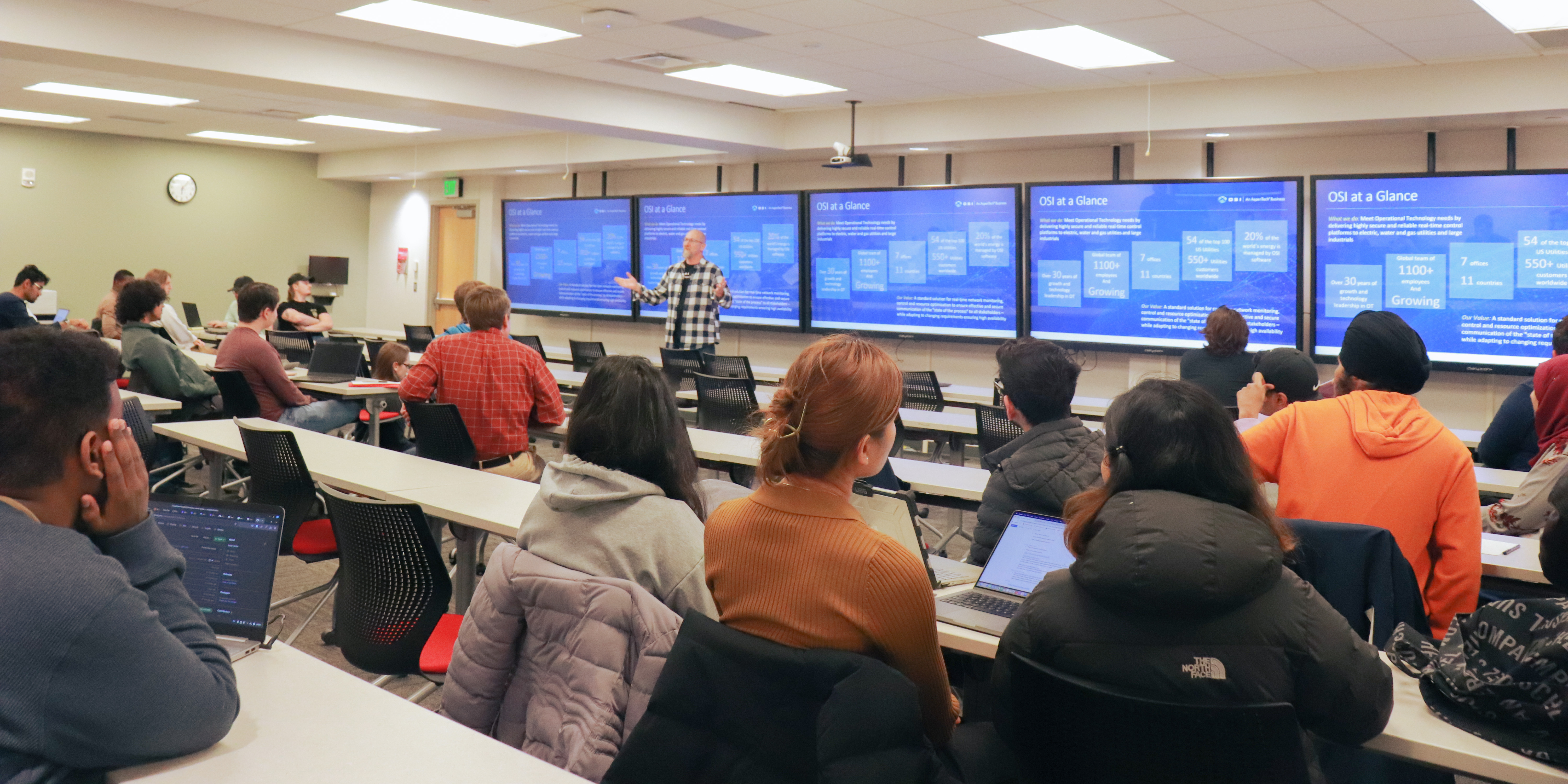Open Systems International (OSI) Representative addressing Hackathon participants