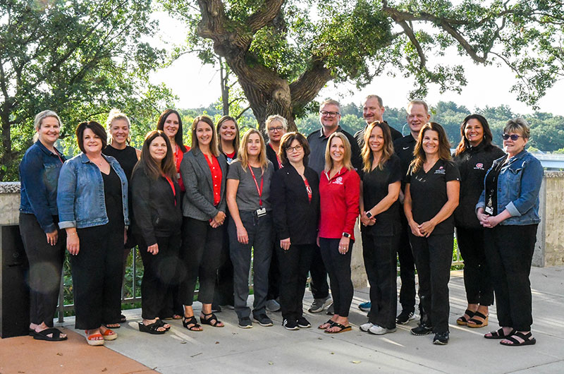 the Medical Clinic and Counseling team outside on a sunny day