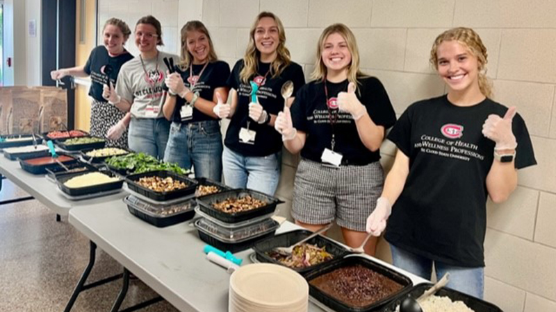 Students serving food