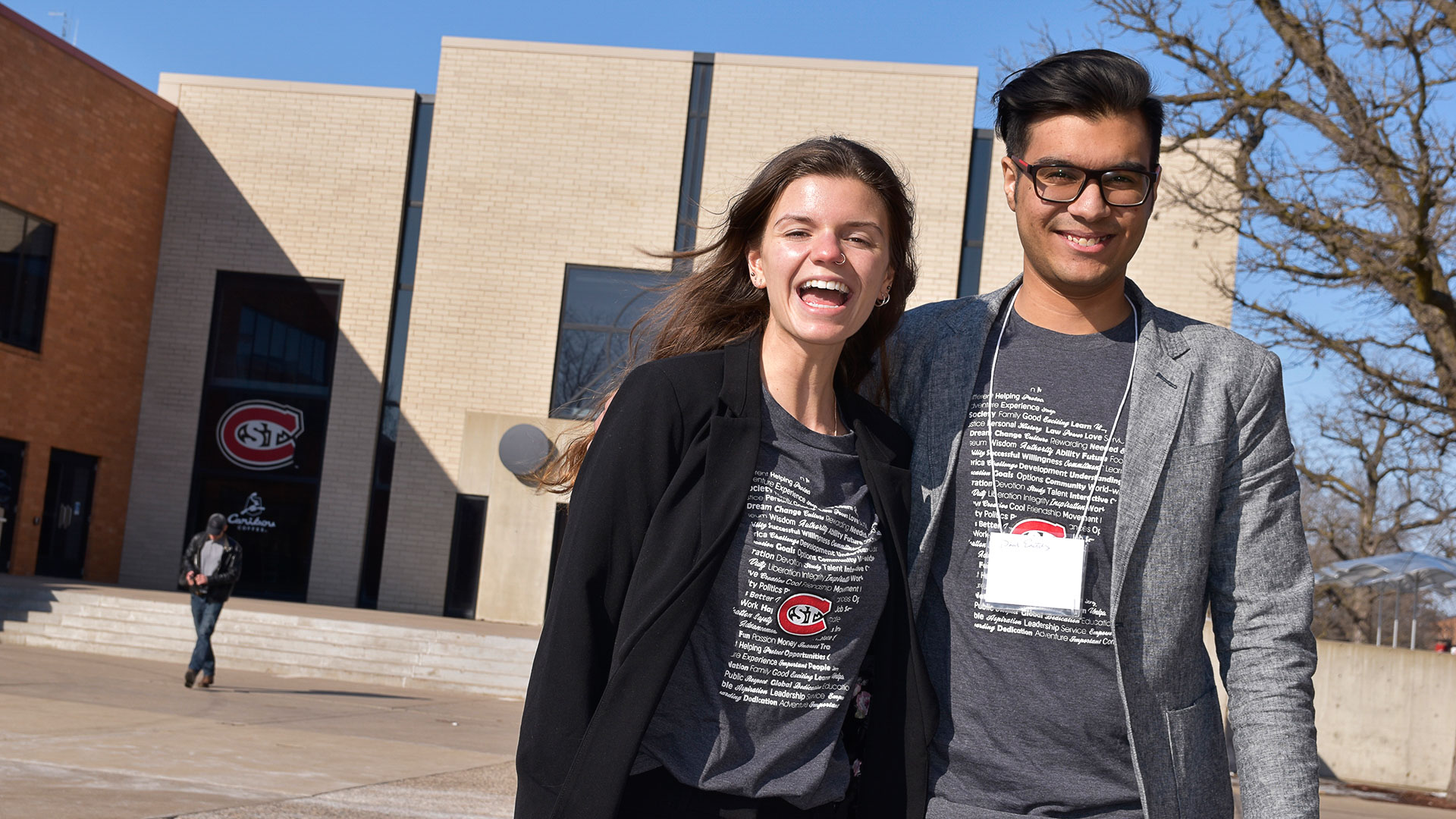 Two students outside of Stewart Hall