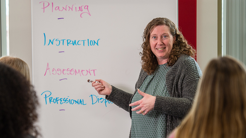 Melissa Brever teaching students in class