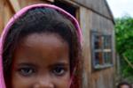 Through Little Girl, McKenzie Sommers: This photo was taken at a daycare in the Port Elizabeth township of Walmer. The township reflects the struggles of poverty in South Africa post-apartheid. The kids who attend this daycare may not get a bed to sleep in at night, food to fill their tummies, or even electricity and running water. This photo truly captures the meaning of this trip for studying race relations in South Africa and how the remnants of the apartheid are still prevalent. This little girl's eyes have seen so much more than we can ever imagine and tell so many stories. 