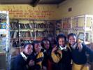 The Power of Education, Annataya Schmid: This photo was taken in the library of a primary school in South Africa. I was given the opportunity to volunteer at it. The entire library was a room with 3 shelves of books. We would read to the children books in English once a week for 2 hours. The children were joyful, beautiful, and eager to change the world (learn something new every day). The quote, "Education is the most powerful weapon which you can use to change the world." reminds me every day of how some of these children had nothing, but still had all the power to change the world by having the opportunity to go to school every day. Something that I think is taken for granted way more that it should be in the U.S.